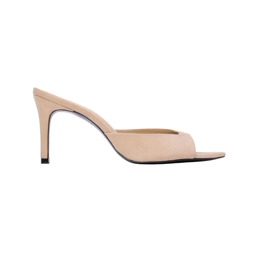 Side view of Brea 80 in Tan Suede showcasing its straight high heel and slipper mule silhouette on white background