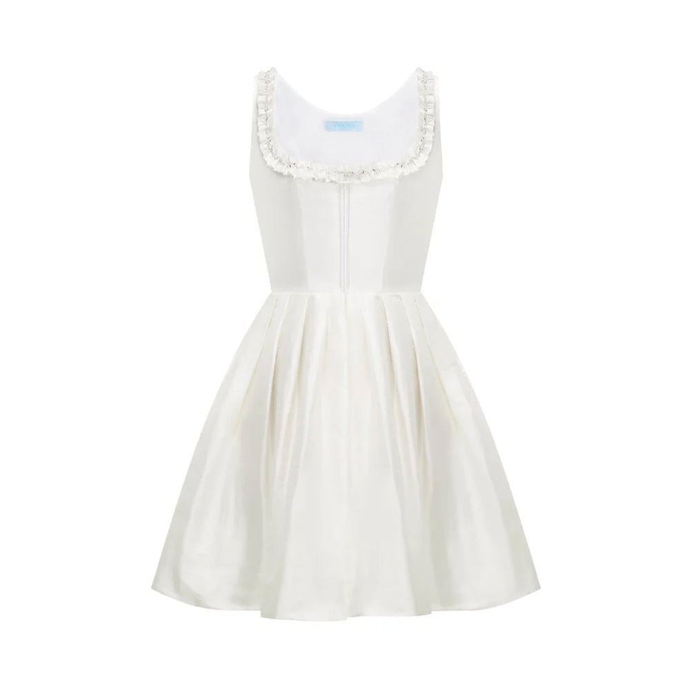 Front view of Bridal Electra off white silk dupion dress with pearl and rhinestone embroidered ruffle neckline on white