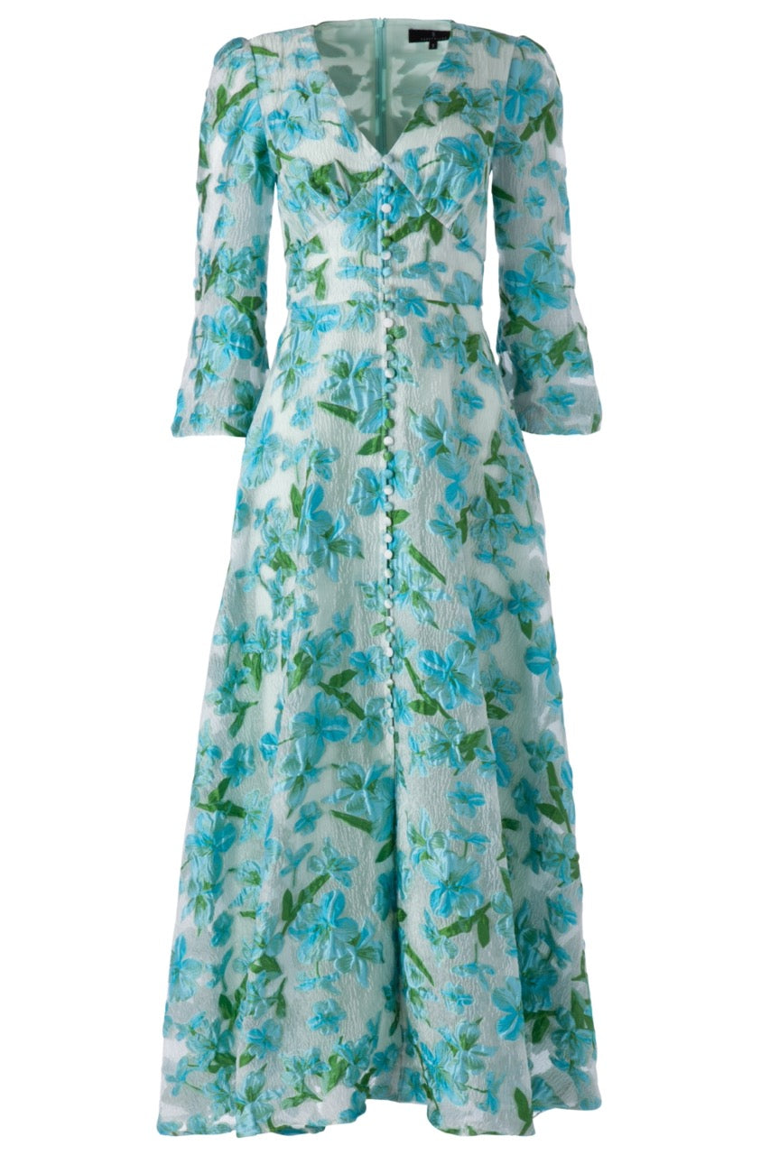Front view of Brooke Gown in Tropical Organza with deep V-neck, front buttons, sheer sleeves, and turquoise floral print
