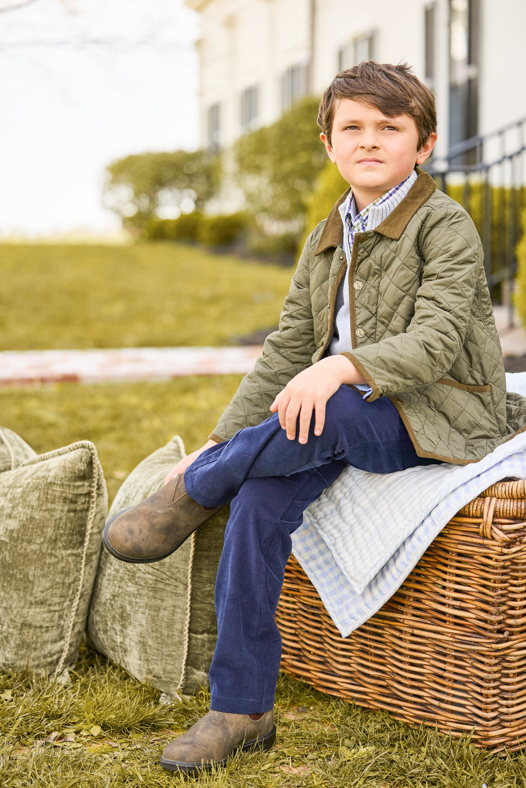 Little English classic childrens clothing, unisex button snap quilted jacket in olive green with corduroy details, Quarter zip sweater in light gray, button down shirt in blue and green coventry plaid, Classic pant in navy corduroy 