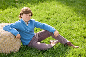 Little English traditional children's clothing. Stormy blue quarter zip sweater layered over blue, pink, and brown Wilmington Plaid button down shirt and paired with chocolate brown corduroy classic pants.  Fall outfit for boys