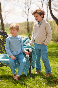 Little English traditional children's clothing.  Classic long sleeve peter pan shirt in blue Alpine Gingham paired with blue Alpine Corduroy pull on pants for toddler boys.  Older boys gray quarter zip sweater layered over blue Alpine Gingham button down shirt and paired with blue Alpine Corduroy classic pants.