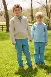 Little English traditional children's clothing.  Classic long sleeve peter pan shirt in blue Alpine Gingham paired with blue Alpine Corduroy pull on pants for toddler boys.  Older boys gray quarter zip sweater layered over blue Alpine Gingham button down shirt and paired with blue Alpine Corduroy classic pants.