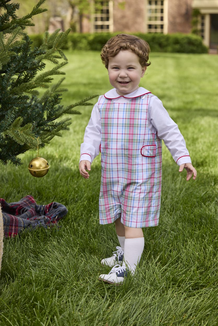 Little English traditional children's clothing.  Holiday John John set for toddler boys. Long sleeve white peter pan shirt with red piping paired with colorful red, yellow, green, blue, and white Douglas Plaid john john