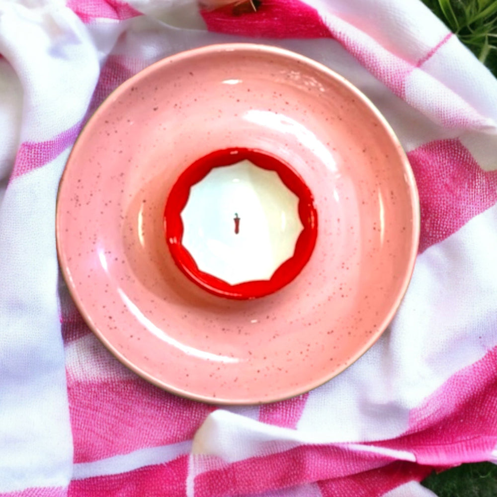 Top-down of Hand-painted Picante Platter showcasing pink speckled glaze and red scalloped center bowl on pink-and-white cloth