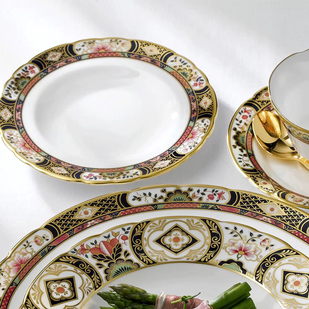 Top view of Chelsea Garden Rim soup bowl showcasing floral border with pink and green accents and 22 carat gold rim on white background