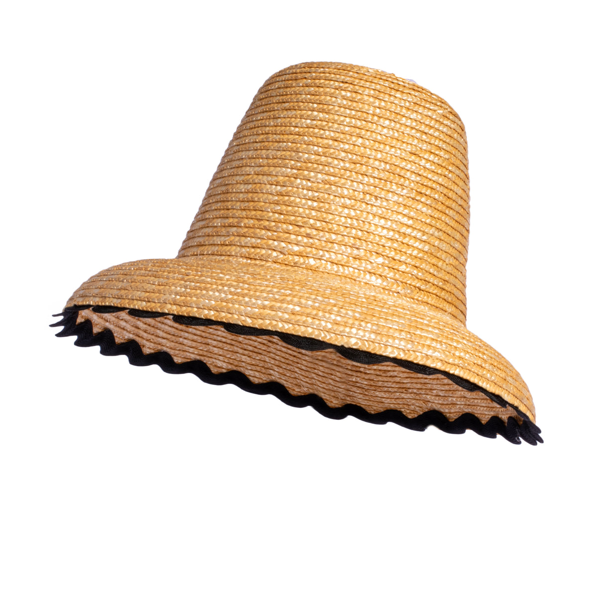 Angled side view of Wavy Hat showcasing natural raffia material and black scalloped wavy trim on brim with white background