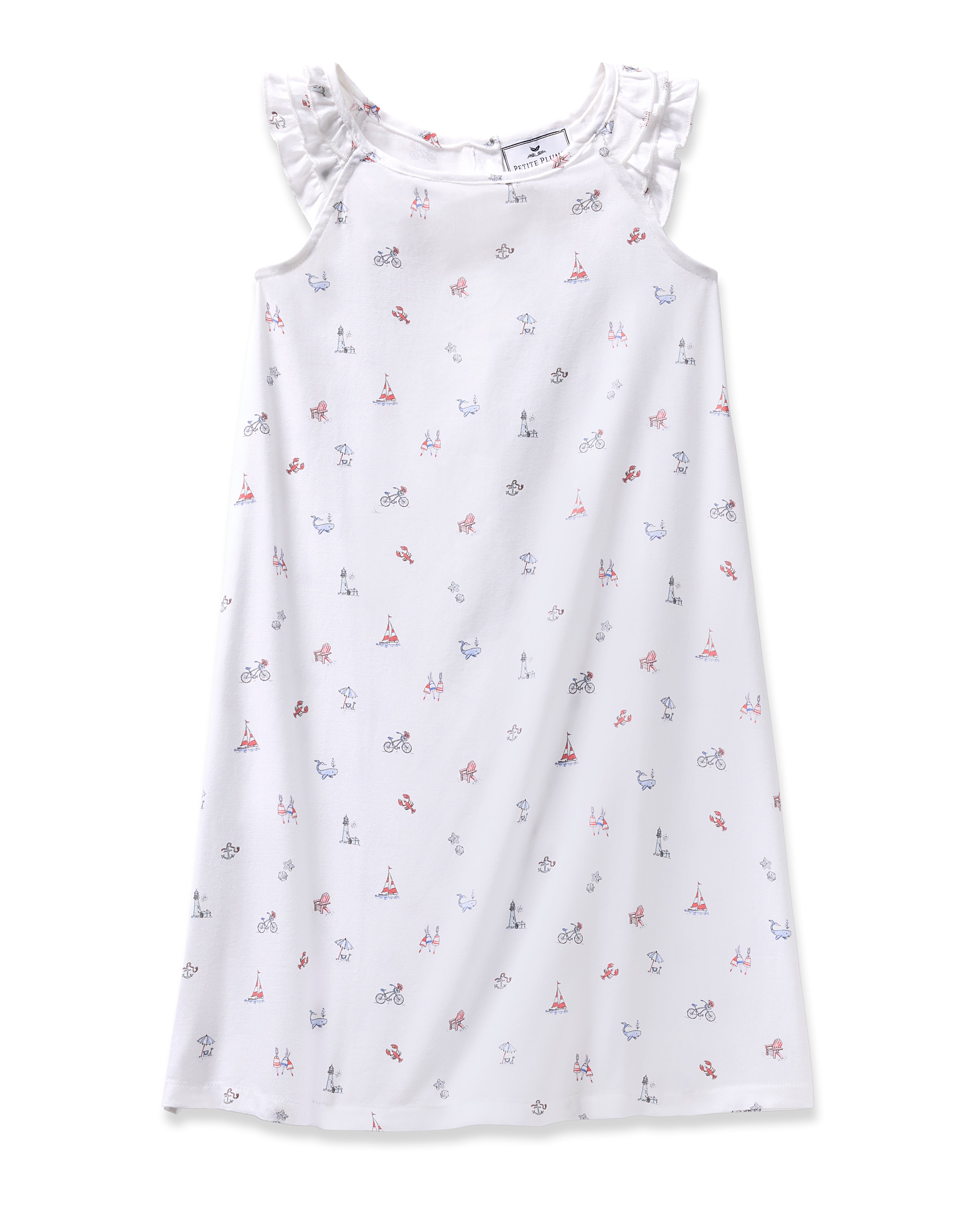 The Girls Twill Amelie Nightgown in Coastal Charms by Petite Plume is a white sleeveless gown with ruffled shoulders, adorned with red and blue illustrations like bikes, Eiffel Towers, and cameras. Made from lightweight cotton, its ideal for wanderlust dreams.