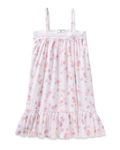 Enjoy the elegance of Petite Plumes Girls Twill Lily Nightgown in Seashell Splendor—a white sleeveless dress boasting pink and purple floral and fruit patterns, yarn-dyed cotton, a lacy trim top, and a ruffled hem for luxurious sleep.