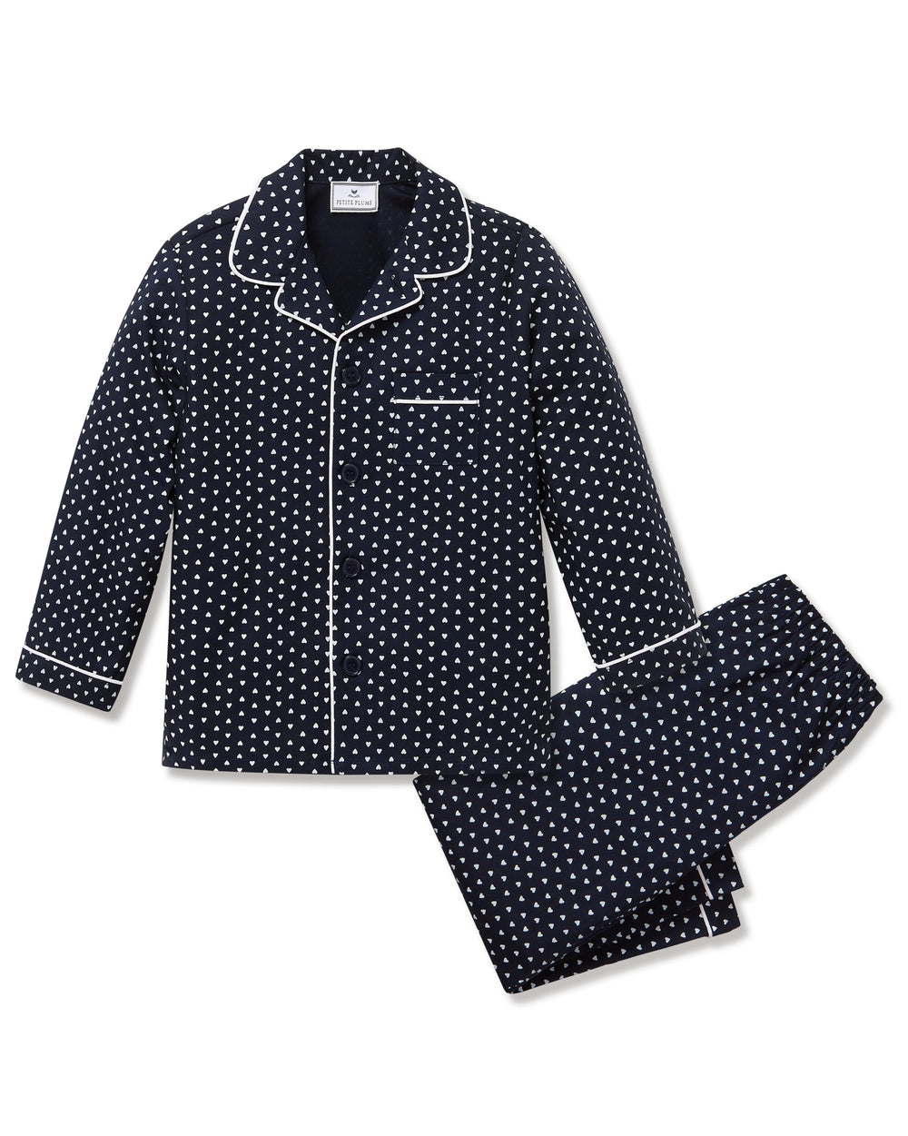 Flat lay of kids twill pajama set in navy Midnight Hearts showing white piped collar, button-front top and matching elastic-waist pants on white background