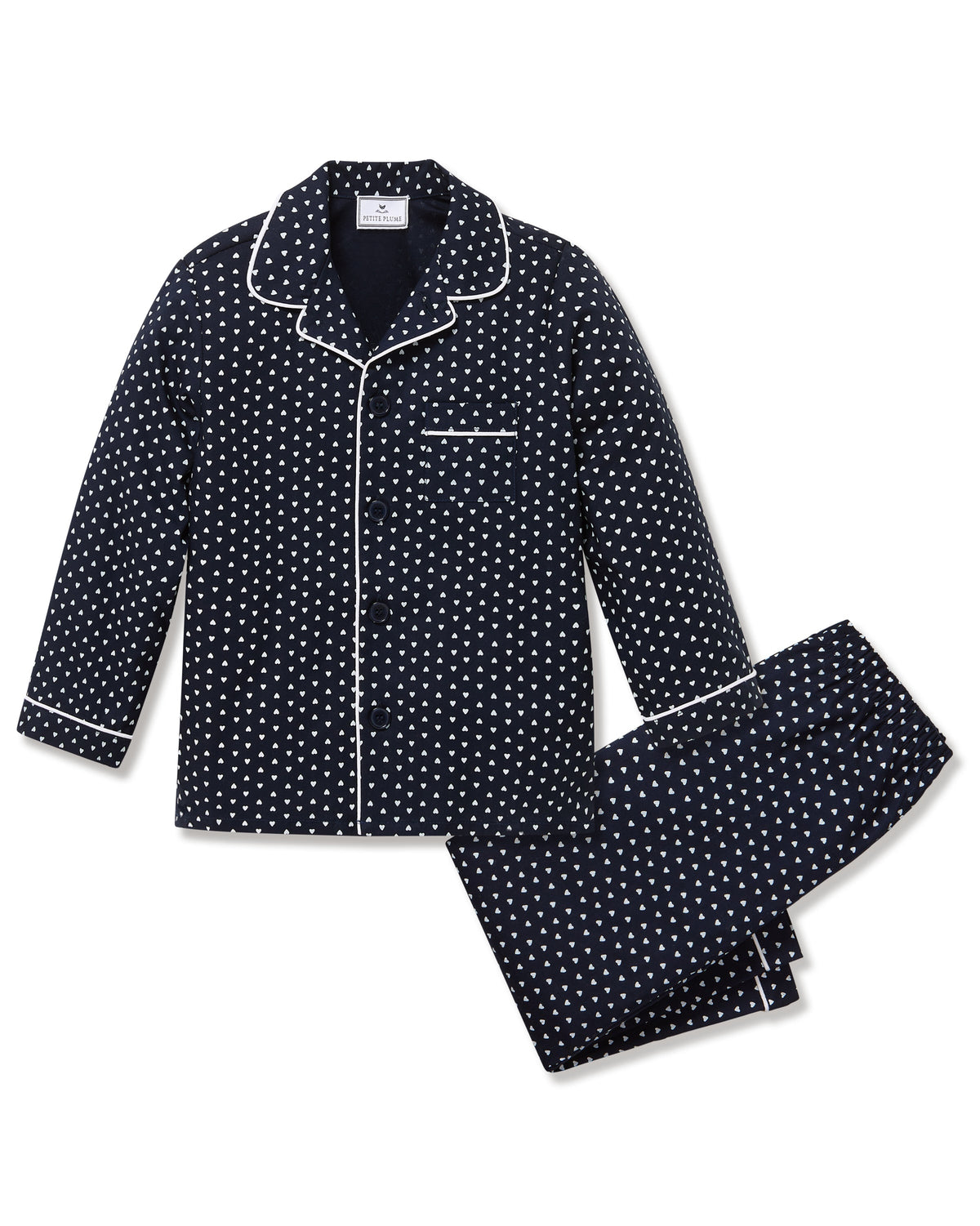 Flat lay of kids twill pajama set in navy Midnight Hearts showing white piped collar, button-front top and matching elastic-waist pants on white background