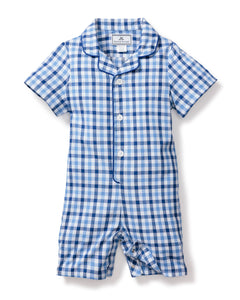 A short-sleeved, button-up romper designed for toddlers features a classic blue and white gingham print. Made from yarn-dyed cotton twill for durability, it has a collar and is labeled Petite Plume. The product is officially named Babys Twill Summer Romper in Royal Blue Gingham.