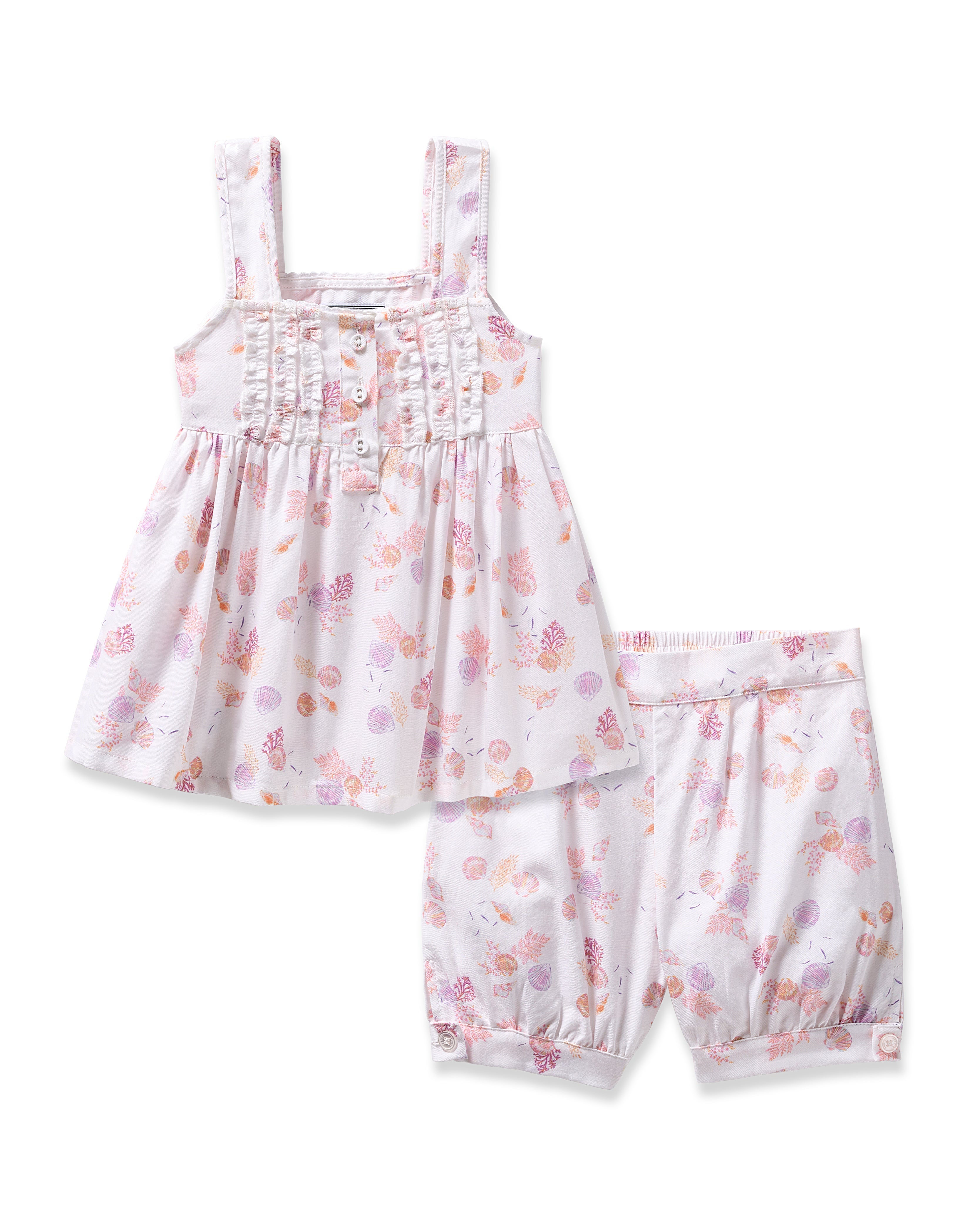 The Girls Twill Charlotte Short Set in Seashell Splendor by Petite Plume is a toddler girls sleeveless dress with a ruffled front and matching shorts, featuring a floral pattern of pink, purple, and orange flowers for a charming summery look.