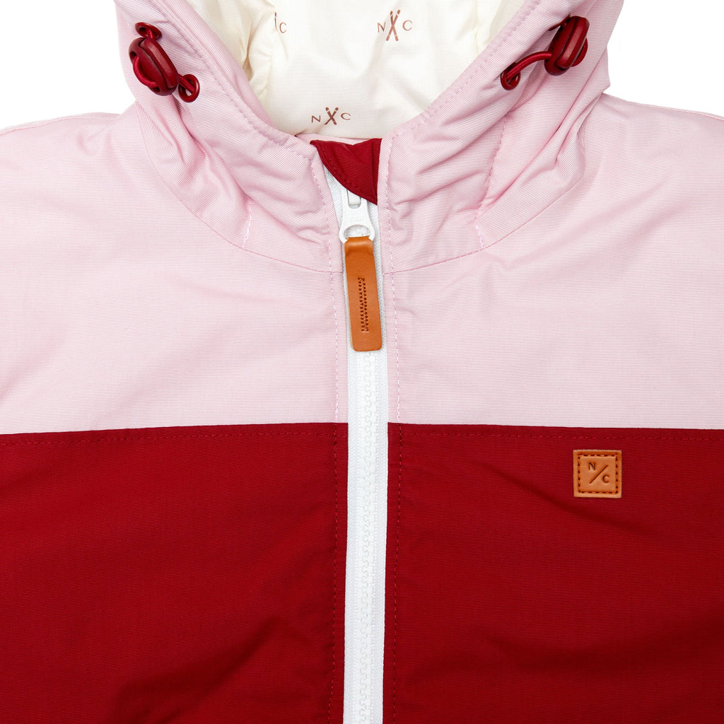 Kids red and light pink winter coat for skiing and snow play, with warm insulation and waterproof outer shell for full cold weather protection and hood