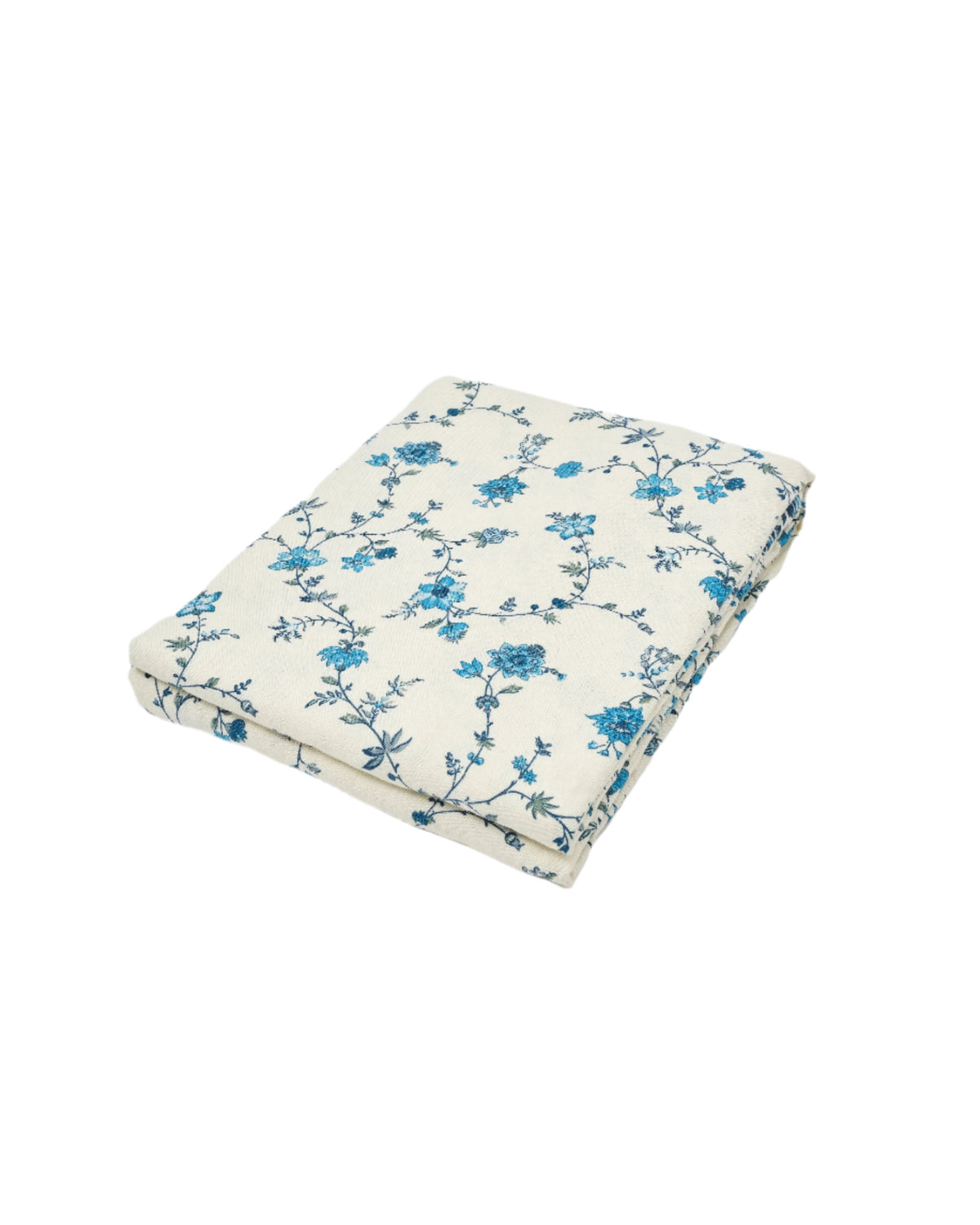 Angled view of D’Ascoli Malabar Tablecloth showcasing blue and white floral print on linen against a white background