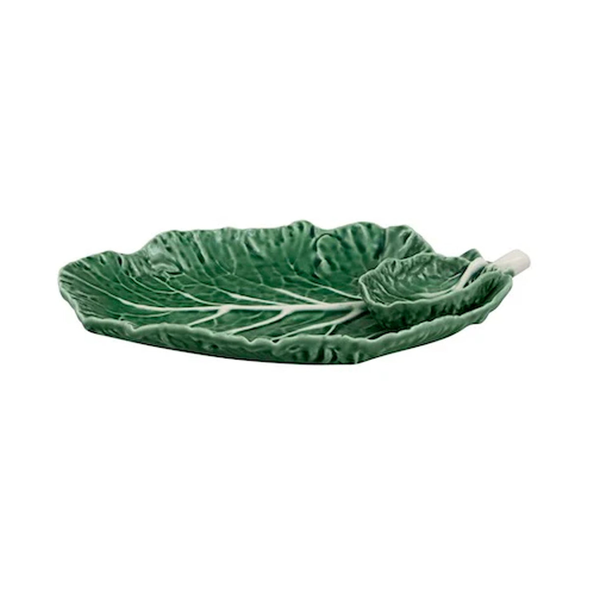 Angled side view of Cabbage Leaf bowl showcasing green hand-glazed earthenware leaf shape with small matching spoon on white background