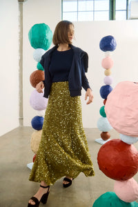 The Callie Sweater in Midnight Blue paired with Lindsey Skirt in Moss Sequin. 