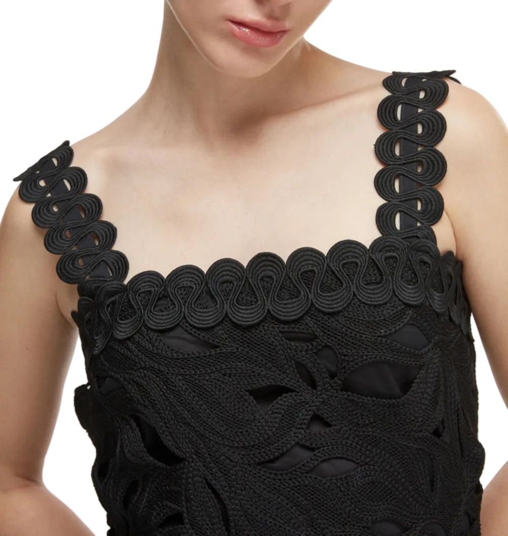 Close up view of Crepusculo Midi Dress in black showcasing scalloped lace straps and lace cutout bodice on white background