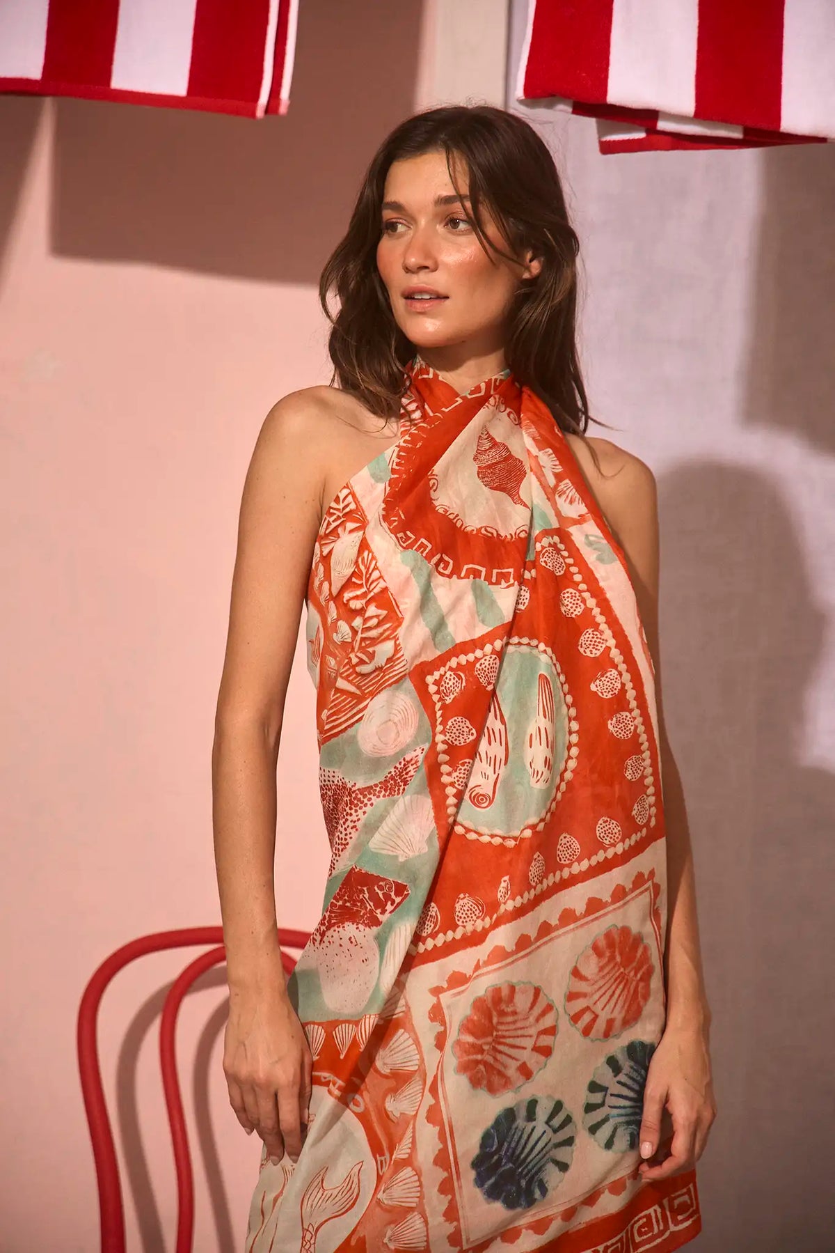 The Sarong Cover Up in Lost at Sea print tied as a halter dress.