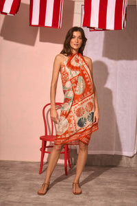 The Sarong Cover Up in Lost at Sea print tied as a halter dress.