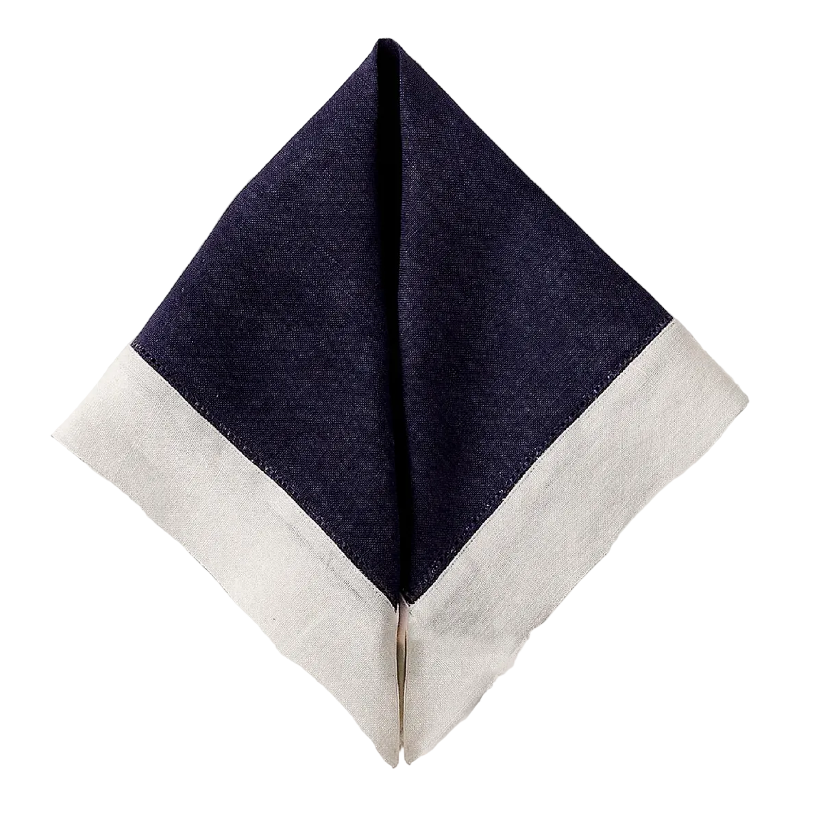 Top-down view of Lisière Napkin in Nuit folded into a pyramid showcasing navy linen with a wide beige border on a white background