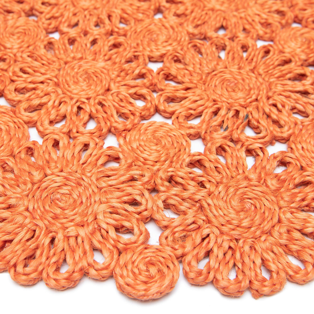 Close-up of Daisy Jute 15-inch round placemat showcasing handwoven natural jute and scalloped floral design
