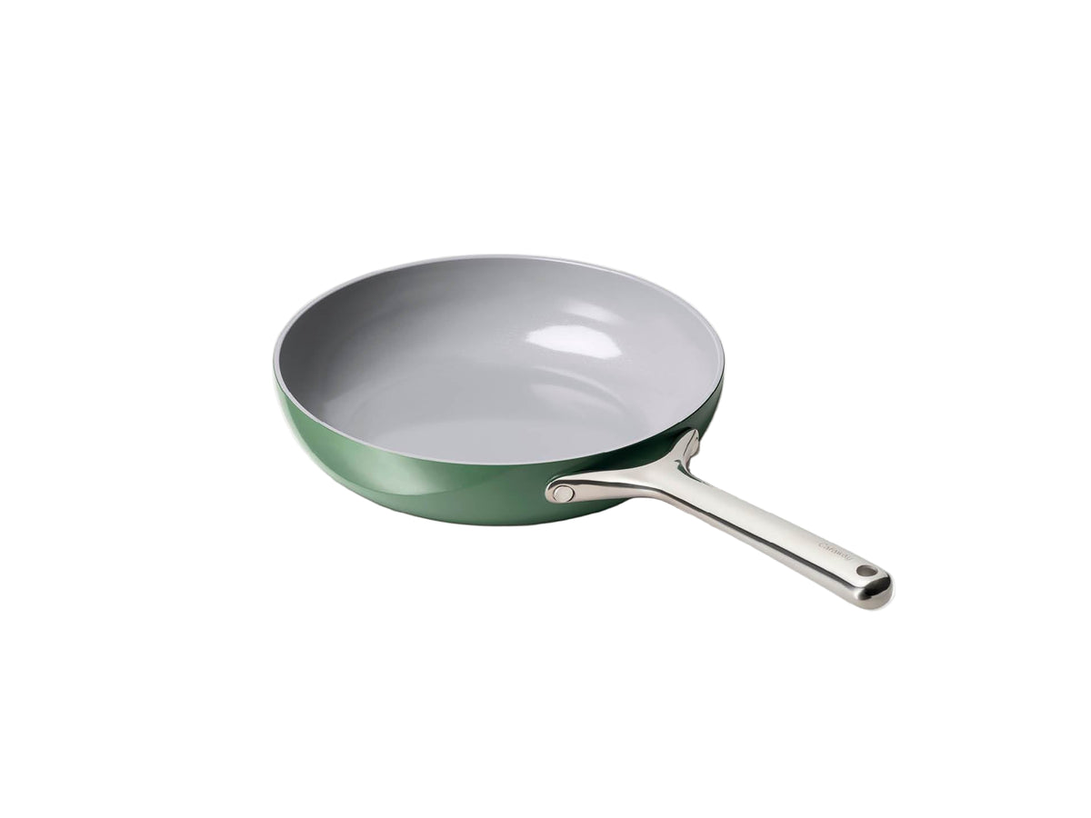 Angled view of 10.5-inch Caraway fry pan in sage showing ceramic nonstick interior and stainless steel handle