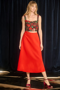 The Adele Skirt, cut on the circle from saturated red crepe with a clean waist and side seam zipper