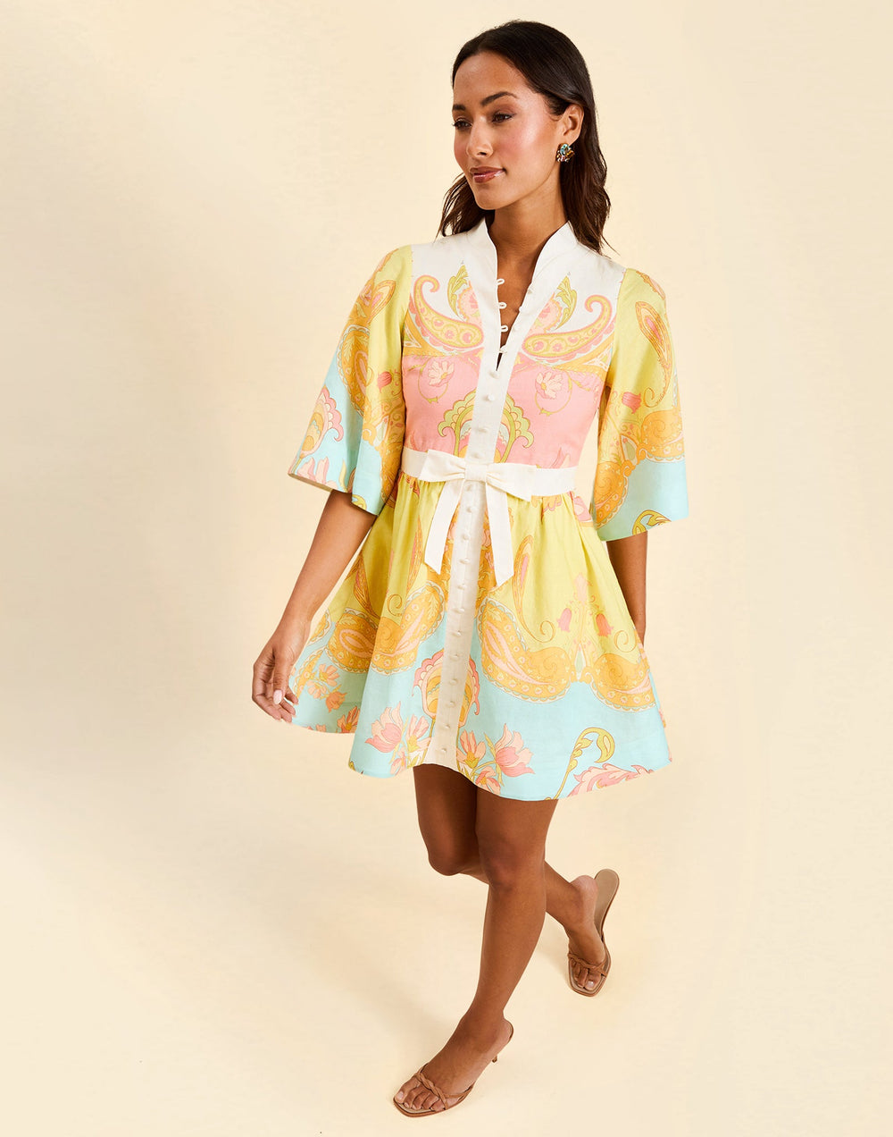 Carmen Mini Dress in Venetian Paisley linen with butterfly sleeves, mandarin collar, and bow waist detail.