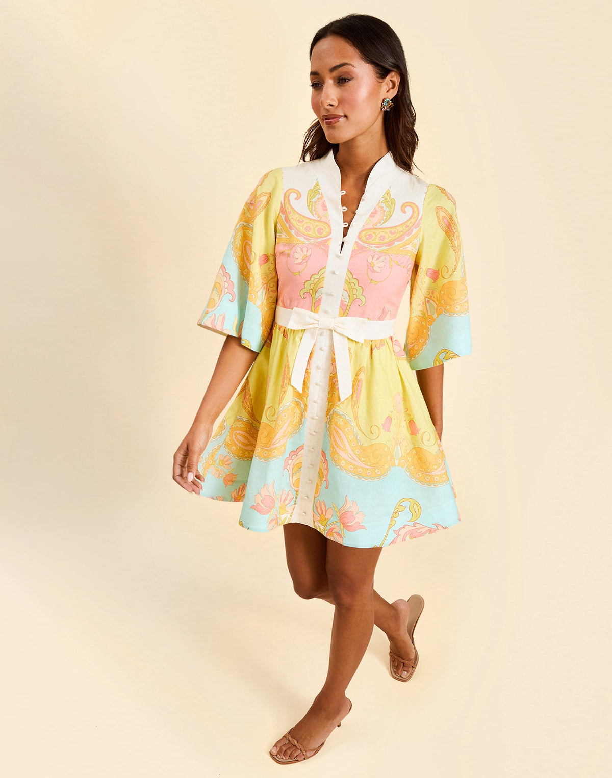 Carmen Mini Dress in Venetian Paisley linen with butterfly sleeves, mandarin collar, and bow waist detail.