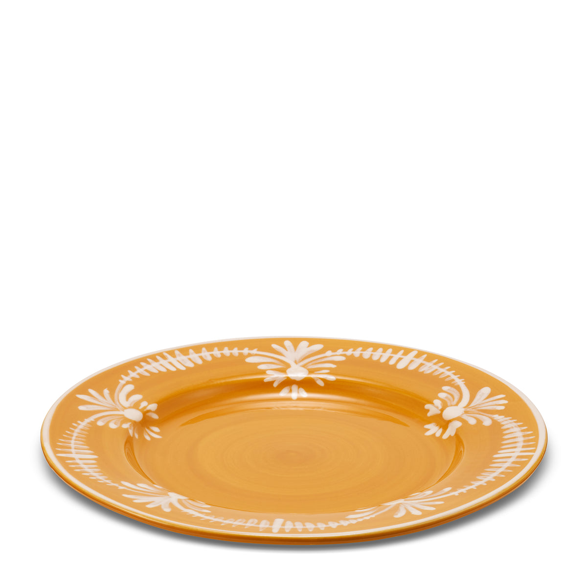 Close-up view of the Dinner Plate With White Floral Trim in Marigold showcasing its hand-painted white floral motif with a white background