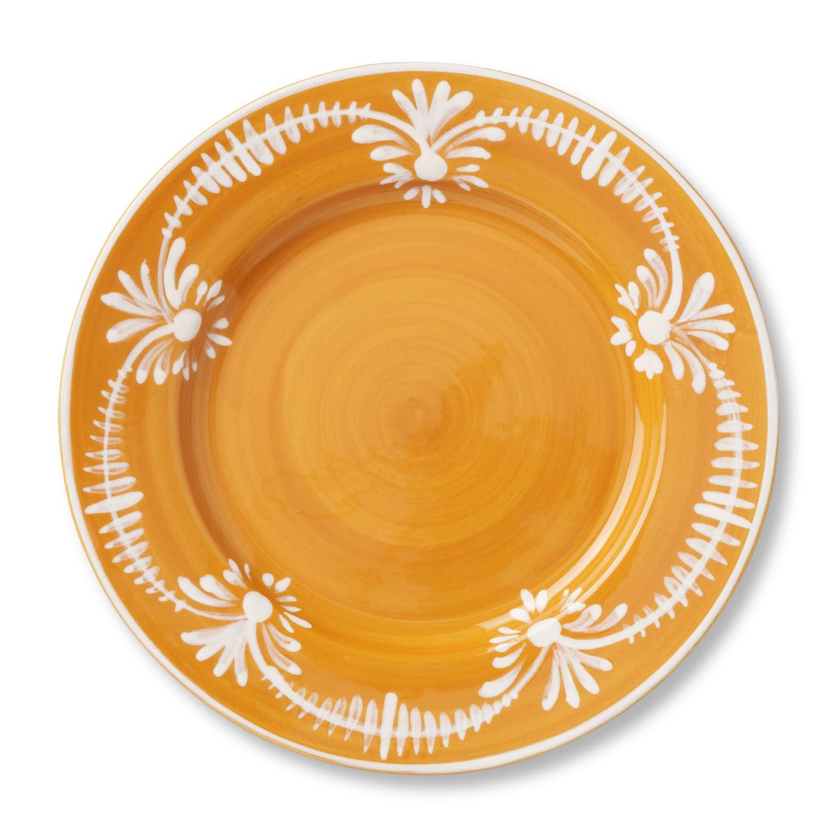Overhead view of Dinner Plate With White Floral Trim in Marigold showcasing hand painted white floral motif with white background