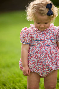 Little English traditional children's clothing.  Soft blue and raspberry red Lennox Floral short sleeve bubble for baby girls with ruffle collar and blue piping detail at sleeves and chest