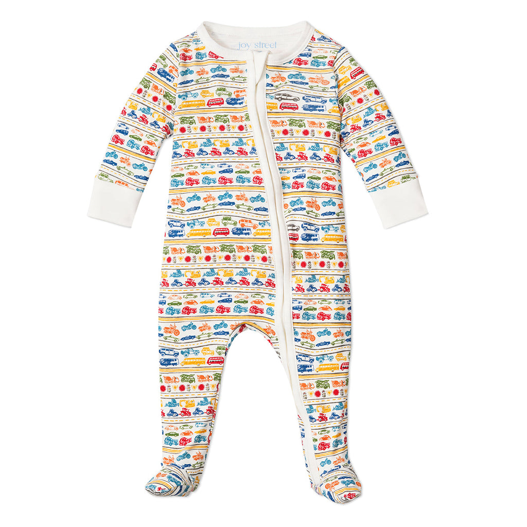 Front view of Cars & Trucks Zip Baby Onesie showcasing colorful vehicle print and footed legs against a white background
