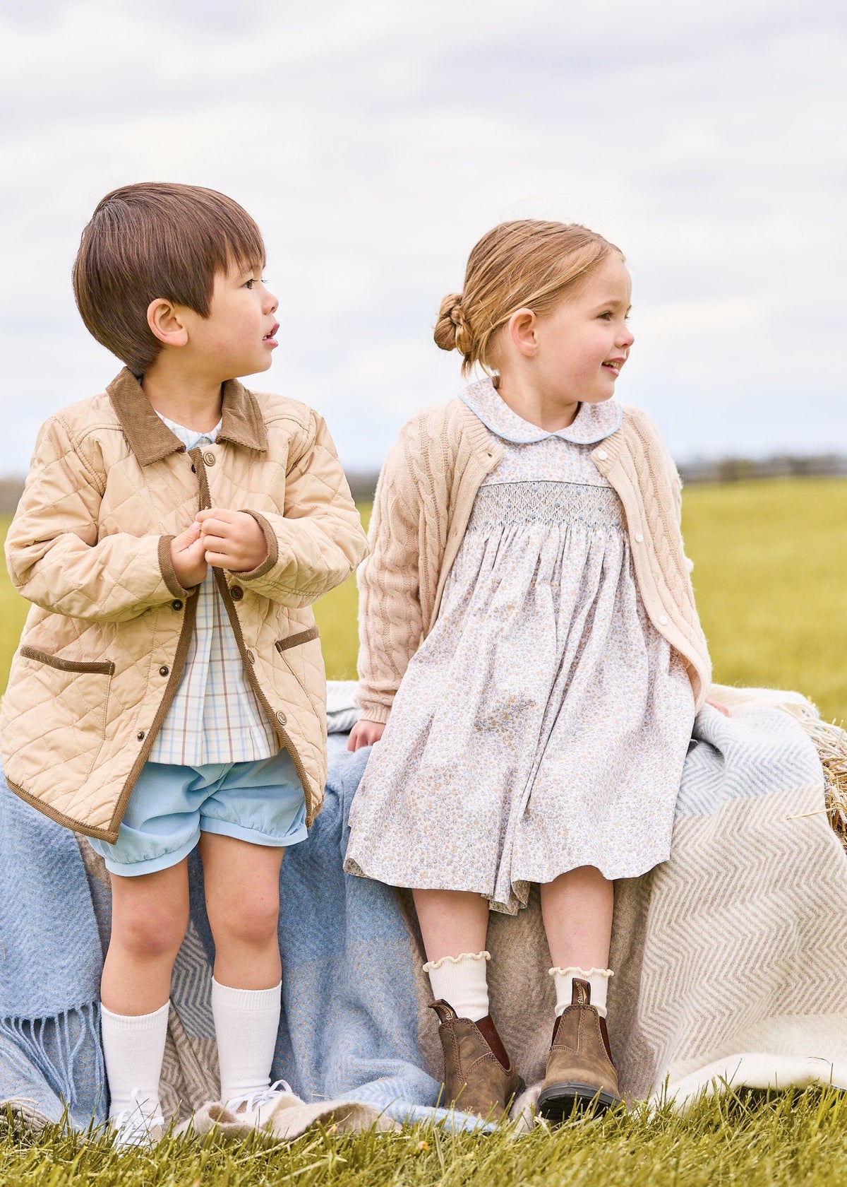 Little english classic childrens clothing, short set for boys in light blue and brown winthrop plaid with light blue corduroy shorts, Classic quilted jacket in khaki, Peter pan dress in winthrop floral print with smocking on chest, cashmere blend sweater in oatmeal, coordinating sibling outfits for fall 
