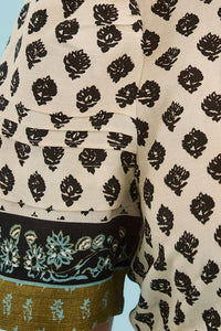 Close up of the Casey Dress in Thistle & Vine Cream.