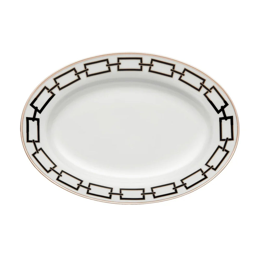 Top view of Catene Large Oval Platter showing black geometric chain border and gold rim on white porcelain