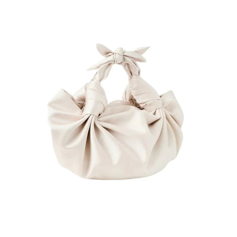 Front view of Champagne Silk Knot Bag showcasing knotted top handles and gathered silky satin body on white background