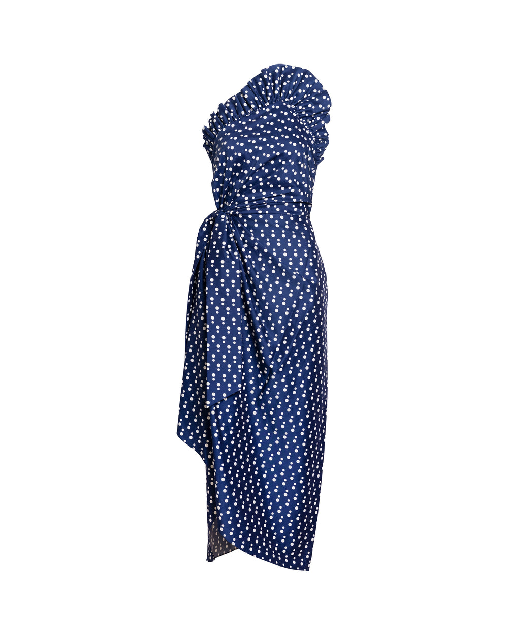 Side view of Charlotte polka dot dress showcasing one-shoulder ruffle, wrap waist tie and asymmetrical midi hem on white background