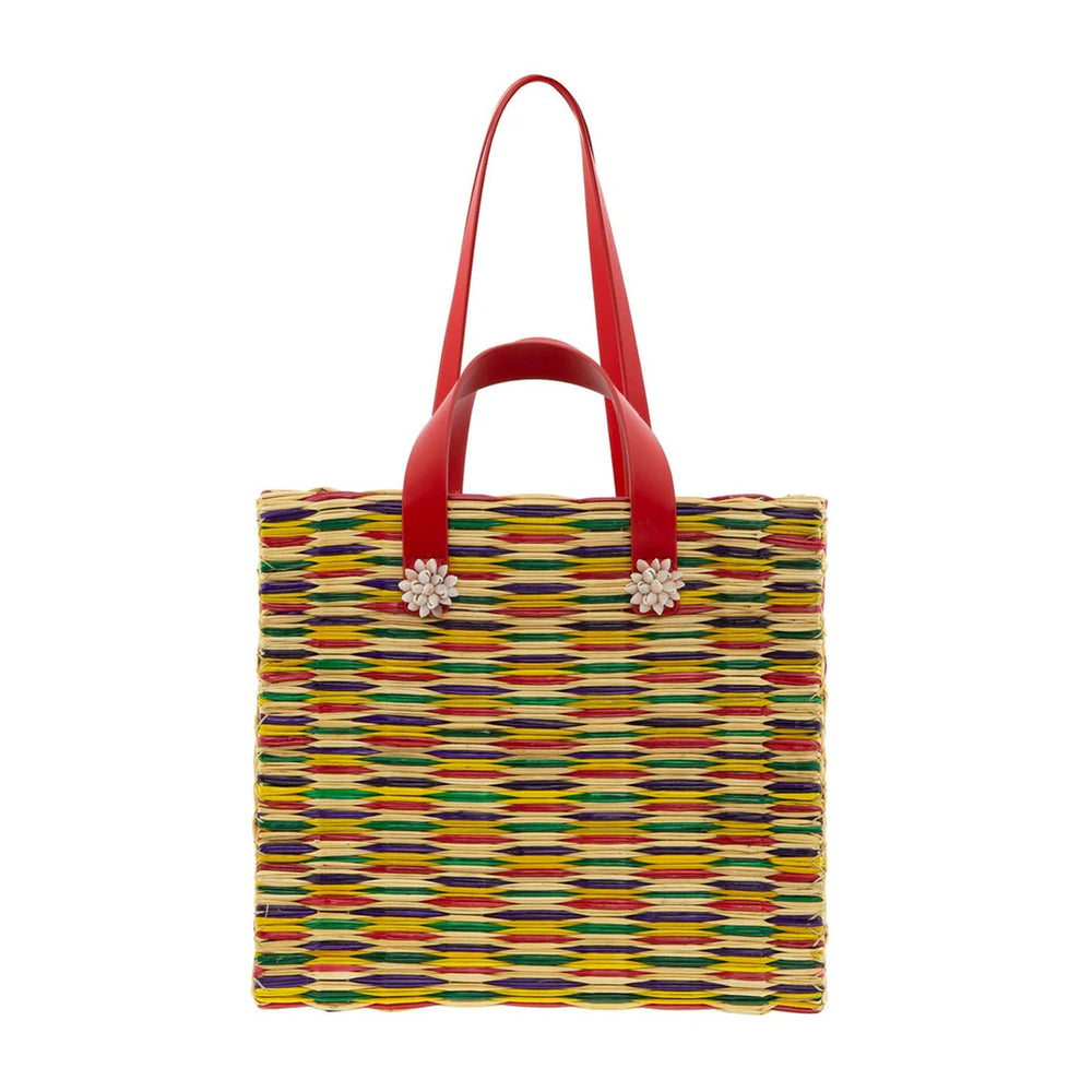 Front view of Chito Tote showcasing multicolor woven reed body, red leather handles with shell flower charms on white background