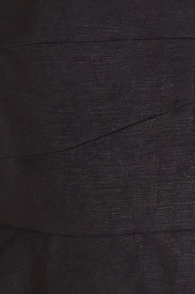 The Chrissy Top is a sleek spaghetti-strap camisole with a seamed bust and a back zipper.