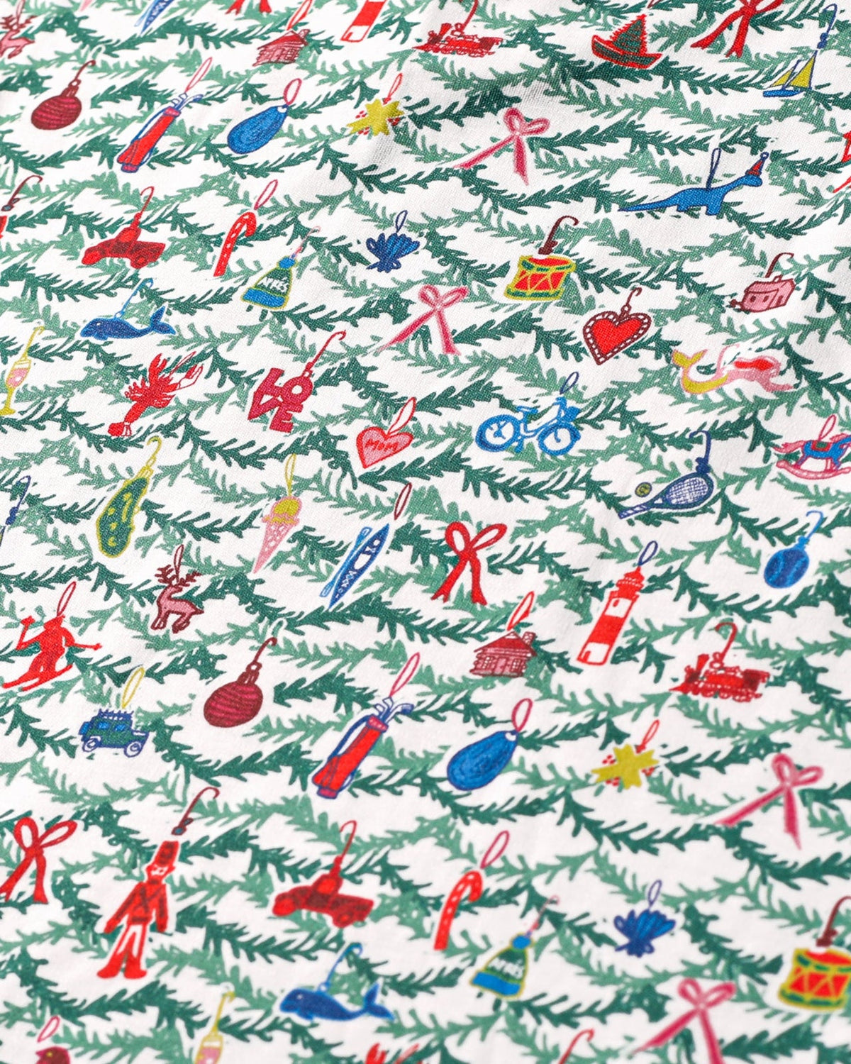 Close-up of Oh Christmas Tree Zip Baby Onesie showcasing hand-drawn evergreen and whimsical ornament print on white fabric