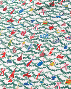 Close-up of Oh Christmas Tree Zip Baby Onesie showcasing hand-drawn evergreen and whimsical ornament print on white fabric