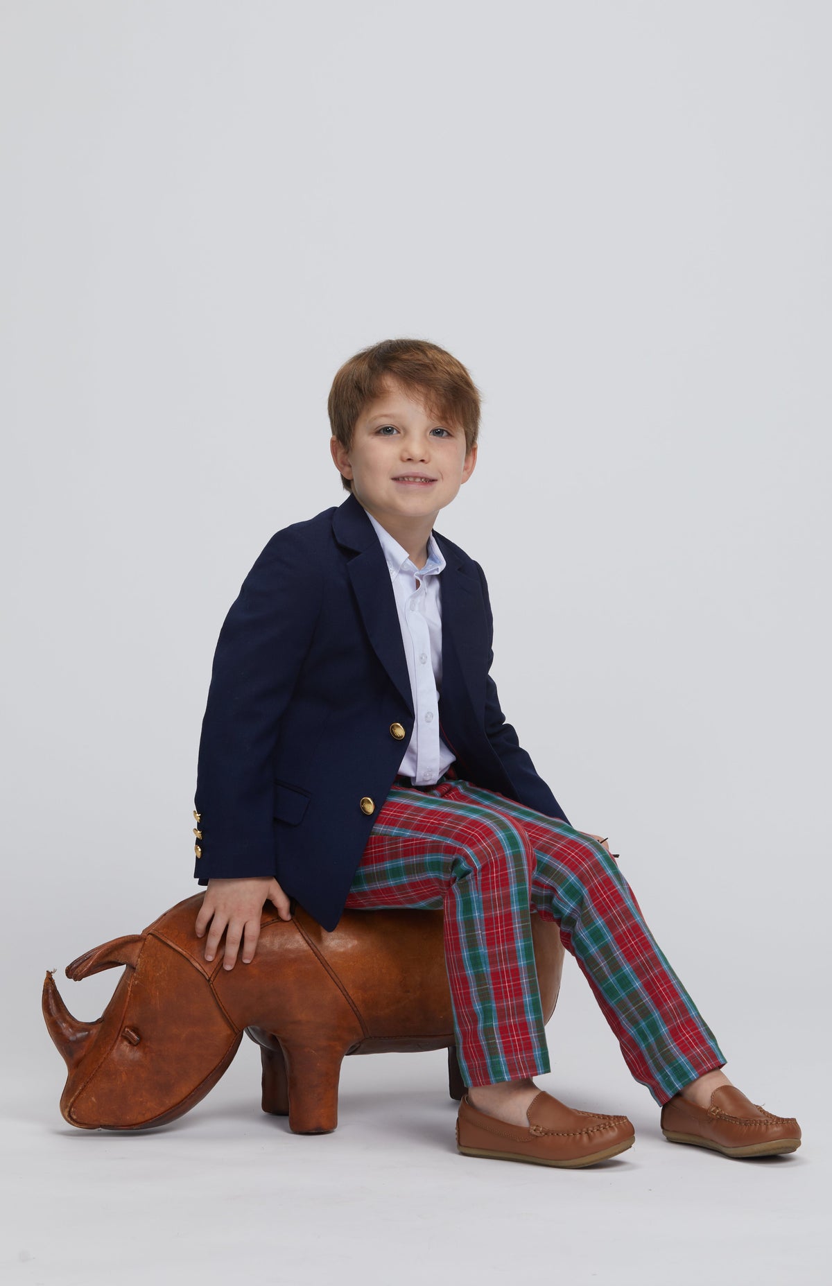 Little English classic boys navy corduroy blazer with buttons down front, Button down shirt in white, classic pant in red, blue, and green highlands tartan pattern