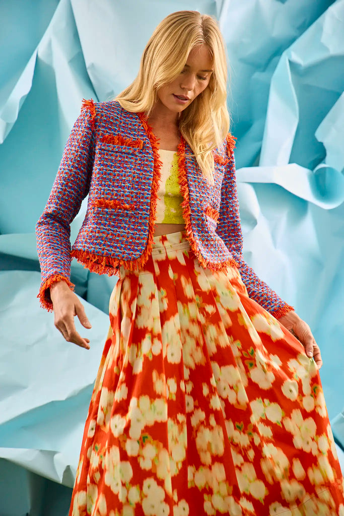 The Coco Jacket is a cropped jacket made with French lurex tweed and finished with Italian cording.