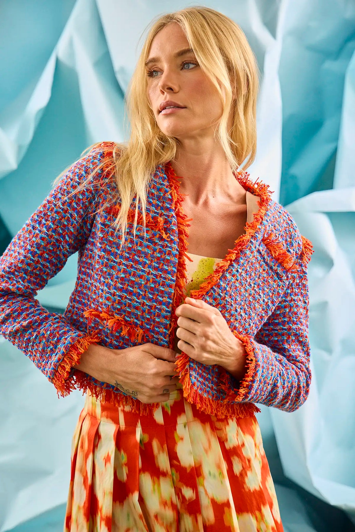 The Coco Jacket is a cropped jacket made with French lurex tweed and finished with Italian cording.