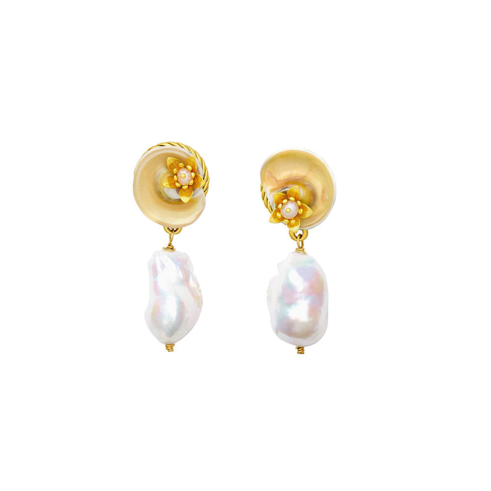 Front view of Coconut Drift earrings with gold shell and floral toppers and baroque pearl drops on white background