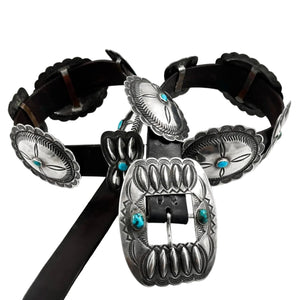 Front view of vintage Concho belt with six sterling silver conchos, five butterflies, turquoise, and black leather