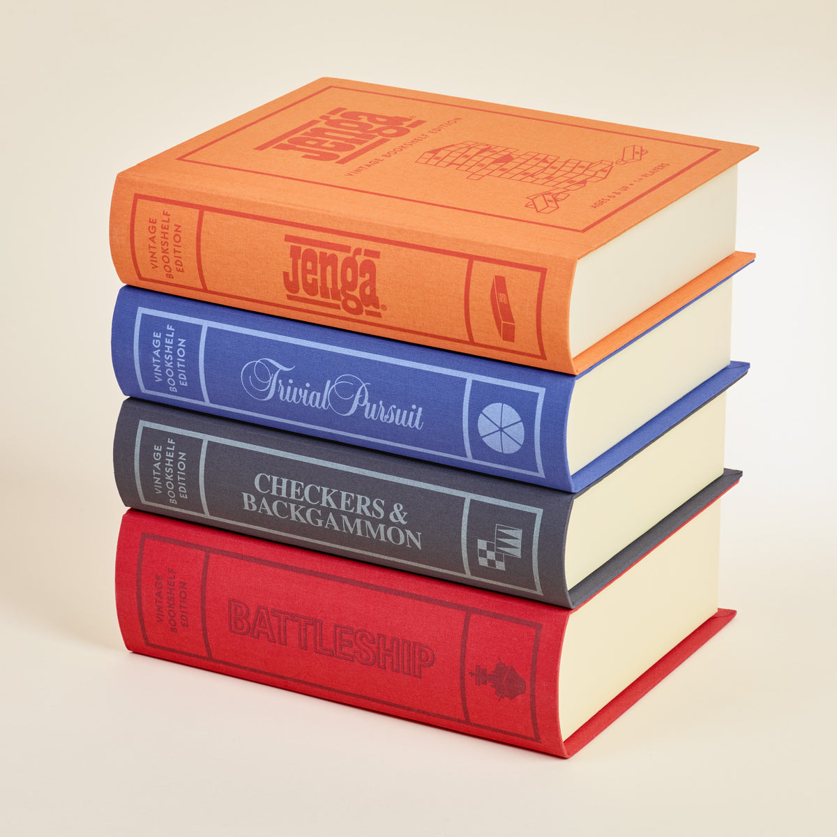 Angled view of 2024 Vintage Bookshelf Assortment set of 4 stacked fabric-bound game boxes with visible titles on a light background