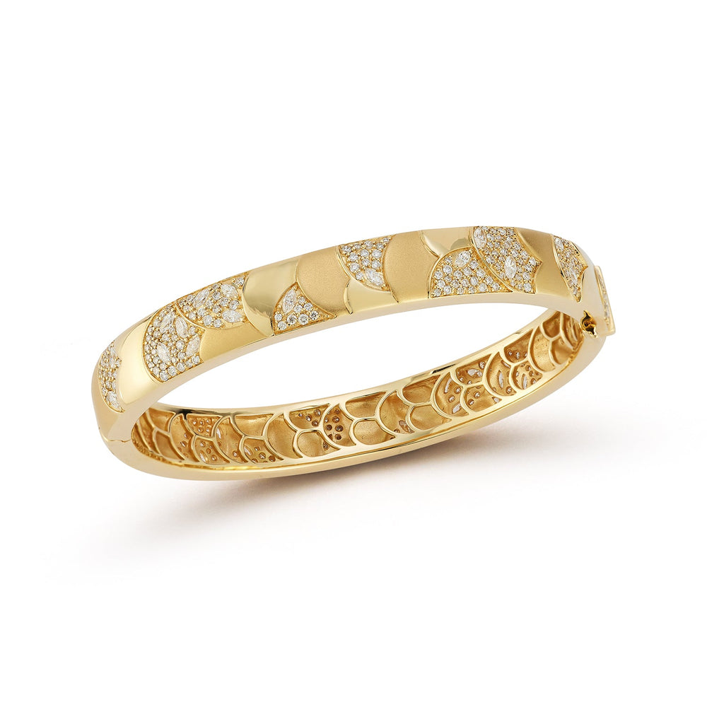 Angled view of Medium Aegean Cuff showcasing 18-karat yellow gold scalloped scales with pave diamonds on white background